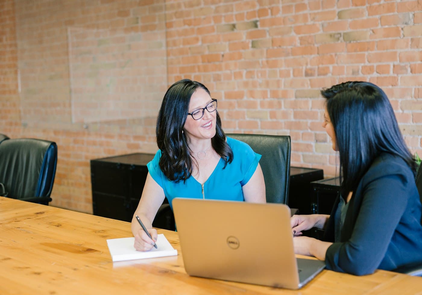 A meeting in progress across a desk